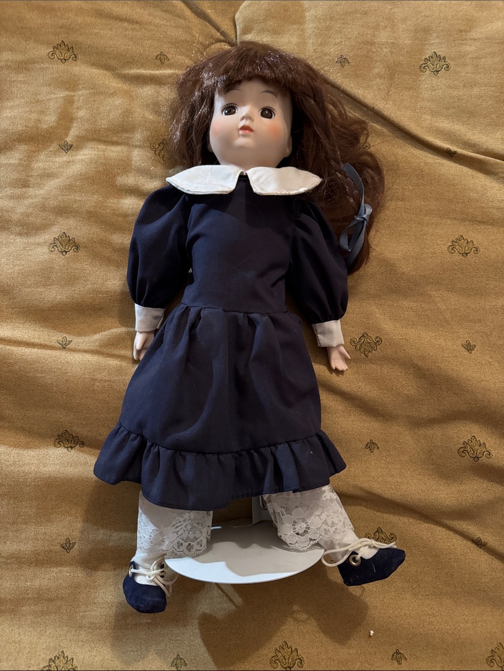 Porcelain Doll in Navy Dress with Brown Hair